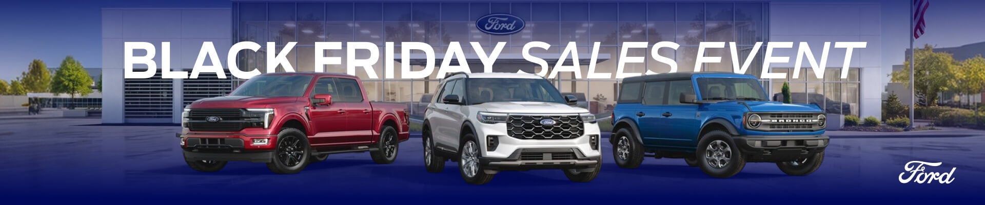 A red Ford F-150, white Ford Explorer and blue Ford Bronco parked in front of a dealership with the words Black Friday Sales Event.